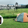 A multi-functional high tensile strength synthetic rope is shown next to a tent in an outdoor field setting.