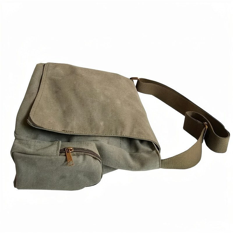 Bolso cruz de lona en verde oliva con correa y cierre de marrón.