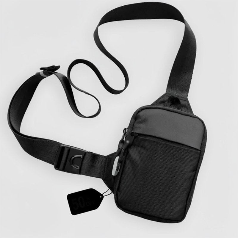 Bolso cruz de nylon negro compacto con hebilla segura y correa ajustable.