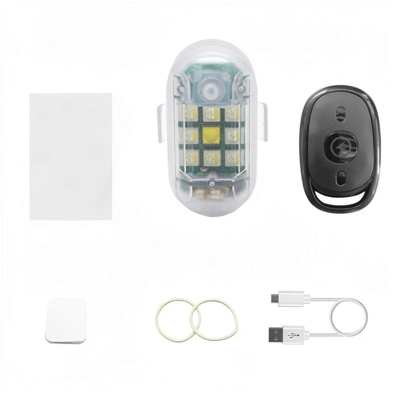 Boîtier en plastique transparent contenant une lumière d'avertissement LED et une télécommande noire pour fonctionnement sans