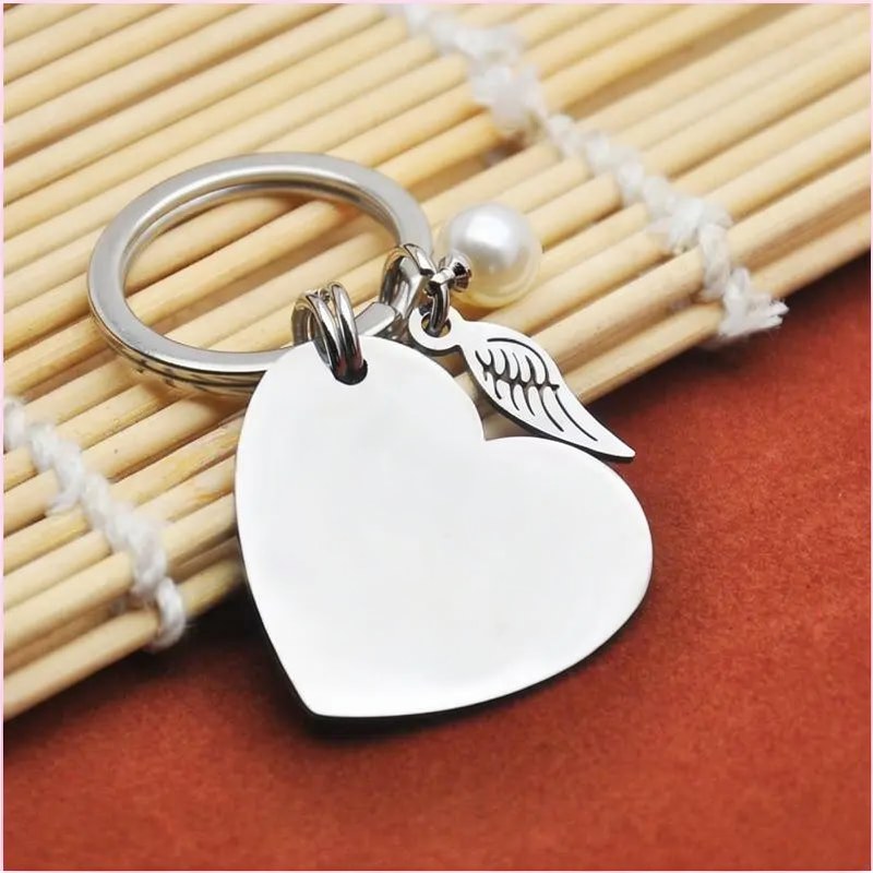 Porte-clés Sœur avec Perle et Pendentif Ailes