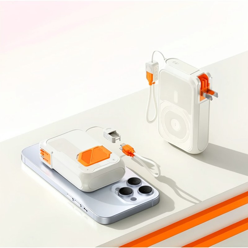 A white Rugged 20,000mAh power bank with orange accents is shown resting on a light gray surface.