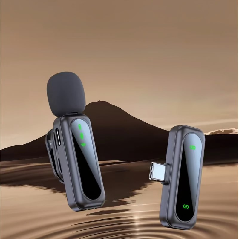 A black wireless lavalier microphone system with two transmitters is shown against a desert landscape.