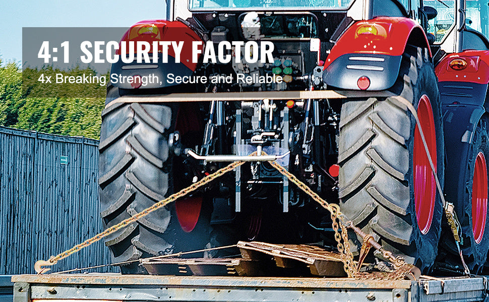 A close-up of heavy-duty transport binder chains with clevis hooks mounted on a tractor tire.